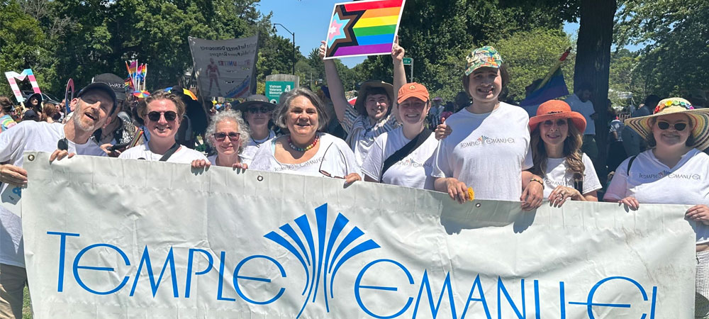 Emanu-El members holding up our Temple banner and pride flag