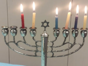 Classic Hanukkah menorah with lit candles