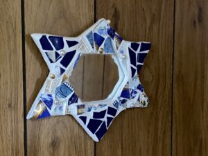 Cermic-framed mirror in shape of mogen david (Jewish Star)