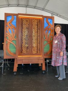 Judy Greenstein next to our Torah ark